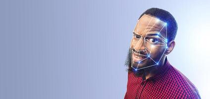 A man with a beard looks towards the camera while facial recognition technology scans his face. The background is empty, highlighting the advanced identification method being used. photo