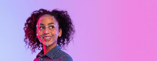 A person with curly hair faces the camera while facial recognition technology highlights specific facial features. The background consists of a vibrant gradient, creating a modern atmosphere. photo