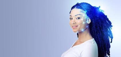 A smiling person displays facial recognition technology on their face, highlighting the intersection of modern technology and personal identification in an isolated setting. photo
