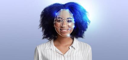 A woman with curly hair smiles as facial recognition technology scans her features. This representation highlights advancements in identification systems, emphasizing innovation in modern technology. photo