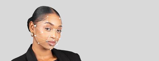 A woman with a confident expression is highlighted as facial recognition technology processes her features. The background is blank, focusing on her uniqueness and the tech's capabilities. photo