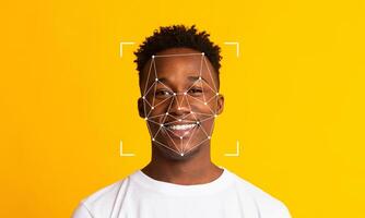 A smiling individual sits against a vibrant yellow background, with facial recognition technology overlay capturing key features. The scene highlights modern identification methods. photo
