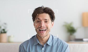 A man displays a joyful expression as facial recognition technology is applied. The setting is bright and welcoming, enhancing the focus on his identifiable features and emotions. photo