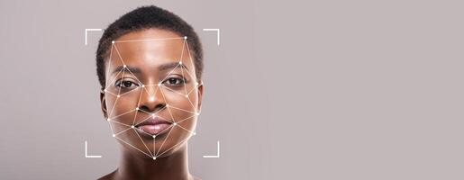 A close-up view of a person's face displaying facial recognition analysis. The focus is on the application of technology for secure identification and verification. photo