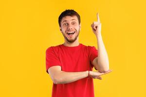 I Have An Idea Concept. Young Funny Man Pointing Finger Up. Excited Guy Knows Answer, Got Solution To His Problem, Having Aha Moment Or Inspiration, Isolated On Blue Studio Background. Wow, Eureka photo