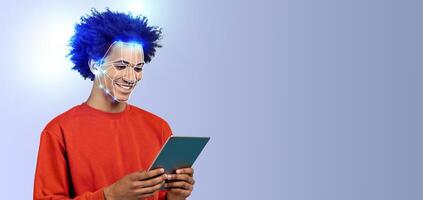 A young person with a cheerful expression engages with a tablet while facial recognition technology is illustrated on their face. The background is a solid, light color, emphasizing the subject. photo