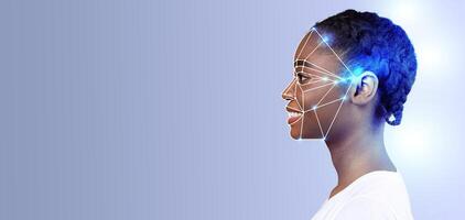 A person engages in advanced face recognition technology, showcasing identification features. The backdrop is minimal, emphasizing the subject's profile and the innovative tech interface. photo