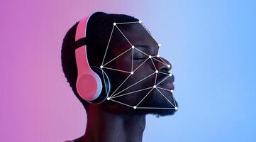 A person wearing headphones listens attentively while undergoing facial recognition analysis. The colorful background highlights the intersection of technology and identity verification. photo