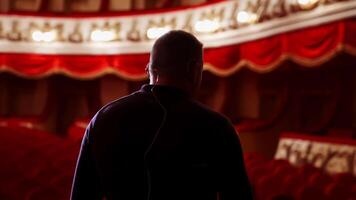 Man entertainer, presenter or actor on stage. Active gestures of clapping to the auditorium. View of a male public speaker speaking at the microphone. video