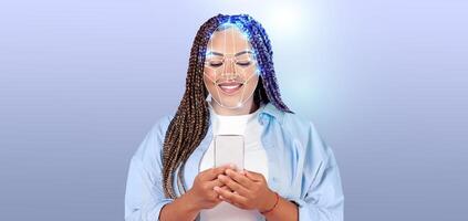 A person with braided hair smiles while using their smartphone. Advanced face recognition technology is illustrated as digital patterns overlay their face. Empty background highlights the subject. photo