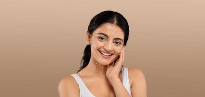 A lady is engaging in her beauty routine, smiling as she applies skincare products. The setting is isolated with a soft, neutral background that emphasizes her joy and pampering experience. photo
