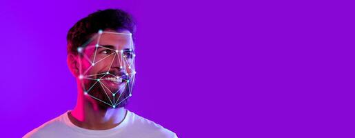 A man smiles while facial recognition technology scans his features against a vibrant purple background. This innovative approach highlights identification advancements and applications. photo