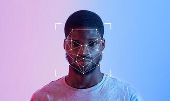 A person stands in front of a gradient background, featuring a facial recognition overlay. The image emphasizes the advancement of ID technology in modern society. photo