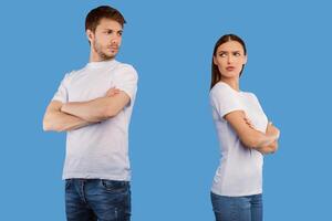 Relationship Problems. Offended couple standing back to back ignoring each other after quarrel, purple studio wall photo