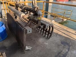 Industrial Grabber Machine on a Dock photo