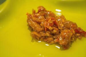 Traditional culinary components include chili, tomato, onion, shallot, shrimp paste, and sambal terasi. photo