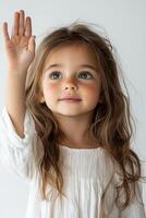 A little girl with long hair waving her hand photo