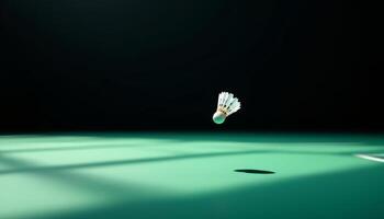 Shuttlecock Mid-Flight on a Green Badminton Court with a Dark Backdrop Creating a Dramatic Contrast photo