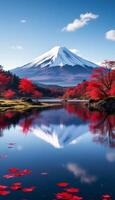 Majestic Mount Fuji Reflection in Calm Waters Surrounded by Vibrant Red Autumn Foliage photo