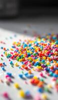 A Colorful Sprinkle Spill on a Bright Surface Creates a Sweet and Playful Pattern photo