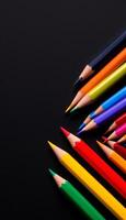Vibrant Colored Pencils Arranged on a Dark Background Ready for Artistic Expression and Creativity photo