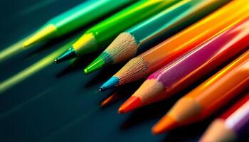 A Spectrum of Colored Pencils Arranged in a Row Ready for Artistic Endeavors photo