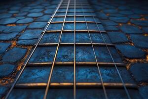Close-Up of Guitar Strings on Cobblestone Background for Music-Themed Design photo