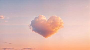 Heart shaped cloud floating in the pastel colored sky at sunset photo