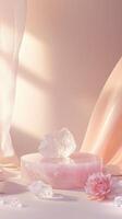 Five pink and white podium crystals arranged on a white platform, creating a serene and mystical atmosphere against a pastel backdrop photo