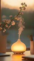 essential oil diffuser releasing aromatic mist near blooming cherry branches, wellness atmosphere aromatherapy photo