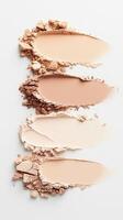 Foundation samples blending across white surface, gradient makeup palette for cosmetic compact powder design and artistic color transition photo