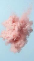 Pink smoke powder exploding on a light blue background, creating a dreamy and ethereal atmosphere photo