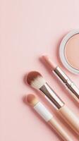 Makeup brushes, lipstick, highlighter, and blush scattered artfully soft pink surface, representing modern beauty product arrangement Copy space for text photo