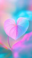 valentine Heart shaped leaf glowing pastel pink and blue, intricate veins illuminating delicate texture with softly blurred background photo