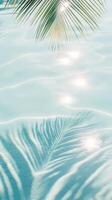 Lush palm leaves fronds mirroring turquoise water sea, casting peaceful summer reflections across luminous tropical seascape with serene vacation vibes travel background copy space for your text photo