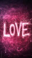 Light painting depicting the word love text, created using sparklers on dark valentine background with pink light trails photo