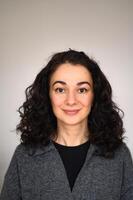 An isolated woman's portrait looking straight forward and smiling photo