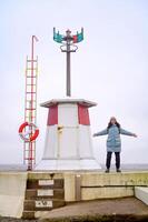 A woman and a lighthouse Lomma Sweden 2025 photo