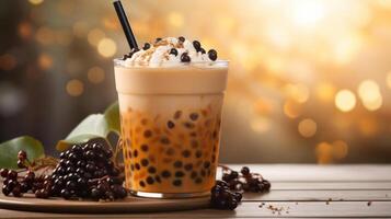 A glass of boba tea with tapioca pearls and whipped cream on top. photo