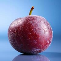 A red apple covered in water droplets photo