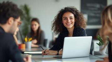 Woman in collaborative office setting engaged in teamwork and discussion. International Women's Day photo