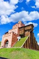 The majestic Golden Gate in the center of Kyiv on a summer day against a blue sky and white clouds. August 21, 2022 Kyiv, Ukraine. photo