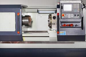Industrial CNC lathe with control panel. Close-up. Copy space. photo