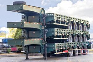 Innovative stacked transport trailers on display in a vibrant outdoor setting. photo