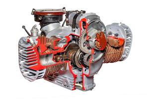 Exploring the intricate design of a classic two-stroke engine in detailed cross-section, isolated on white background. photo
