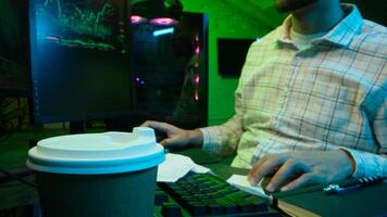 Pensive Caucasian man professional software engineer guy male coder programmer crypto specialist drinking coffee workplace looking computer thinking pondering creating innovative digital application photo