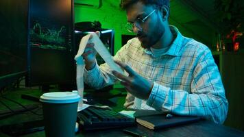 Caucasian focused man programmer checking coding guy coder male professional digital engineer IT support drinking coffee typing working on desktop computer creating Innovative software developing app photo