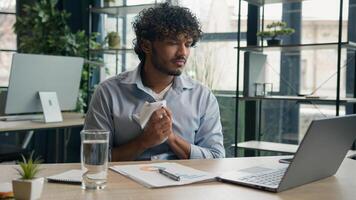 Arabian Hispanic businessman anxious desperate office worker annoyed man work financial data analysis write strategy business audit graphs crumpling sheet of paper throw away burnout failure mistake photo