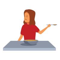 Girl disgusted by soup at table holding spoon vector