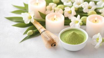 Matcha tea powder with candles and flowers create serene atmosphere photo